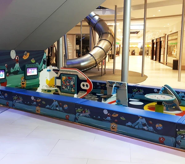 This image shows a custom kids corner within a shopping center in Spain