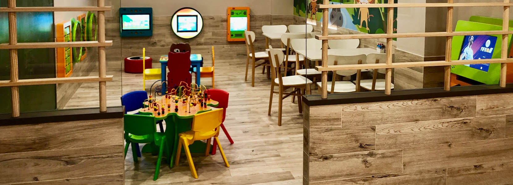 On this image you can see a kids' corner with kids' furniture
