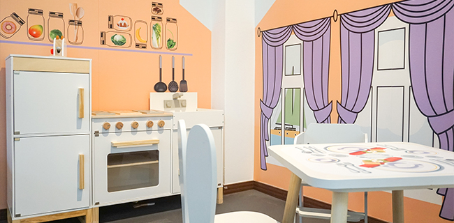 IKC play corner with kitchen for children in children's cafe Bude Eins in Pempelfort Germany