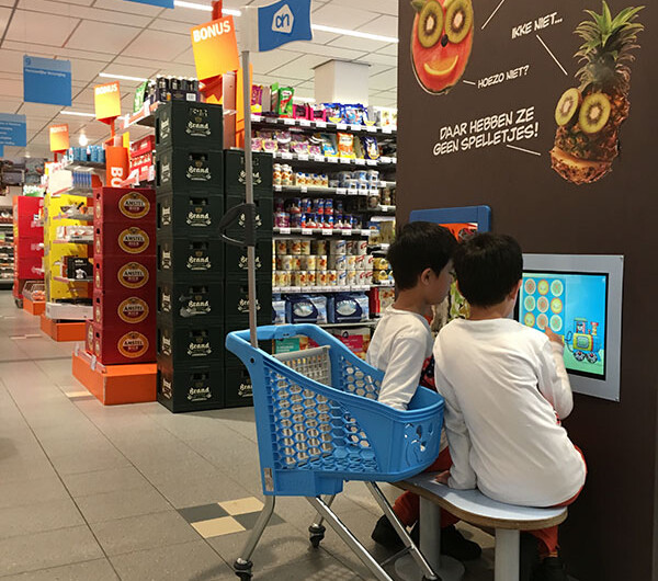 Albert Heijn kids corner supermarket This picture shows two boys playing at the Albert Heijn kids corner supermarket