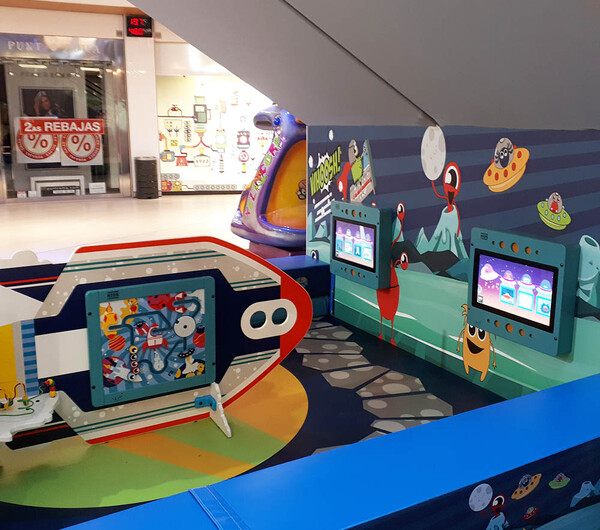This image shows a custom kids corner within a shopping center in Spain