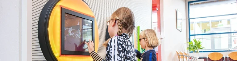 kids corner with touchscreen games in waiting room kids corner with touchscreen games in waiting room