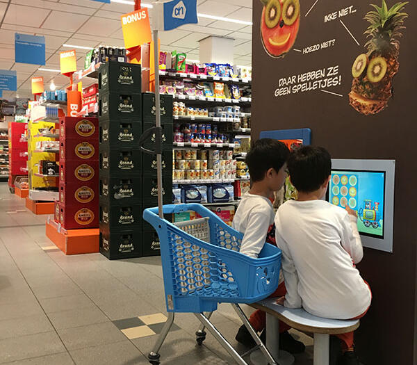 Albert Heijn kids corner supermarket This picture shows two boys playing at the Albert Heijn kids corner supermarket