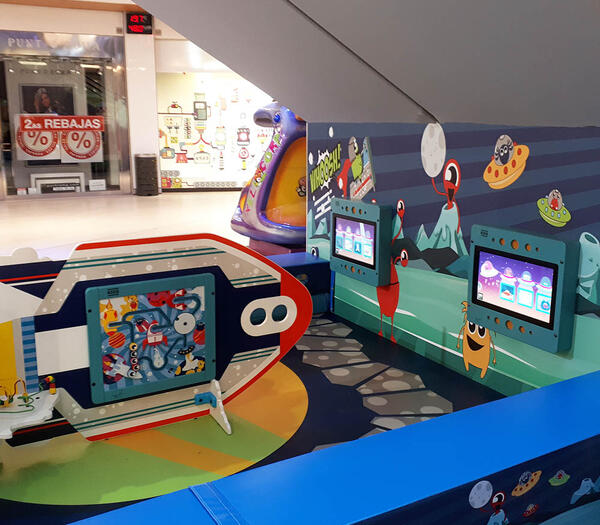 This image shows a custom kids corner within a shopping center in Spain